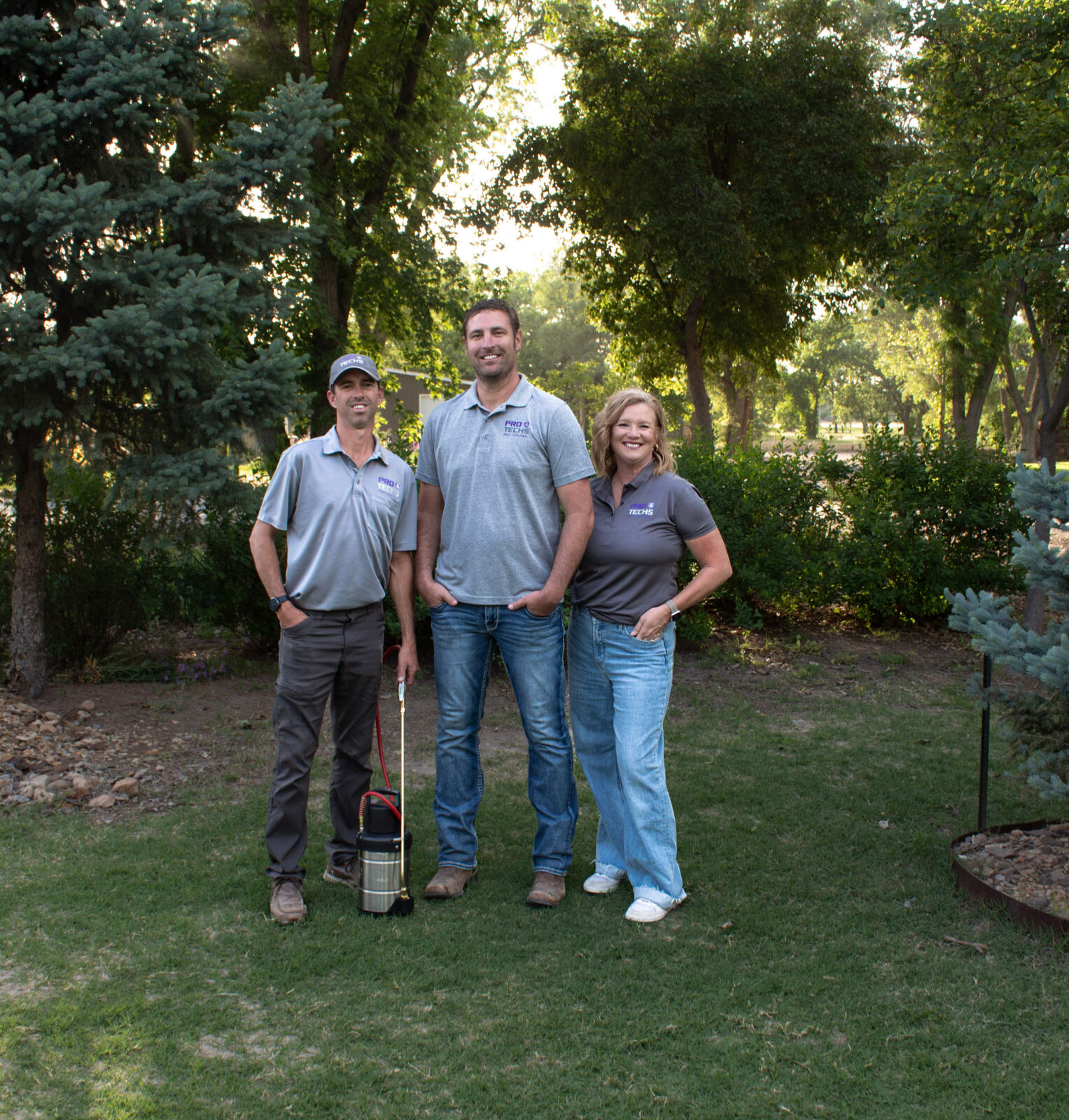 The family team behind Pro Techs Pest Control standing together outdoors